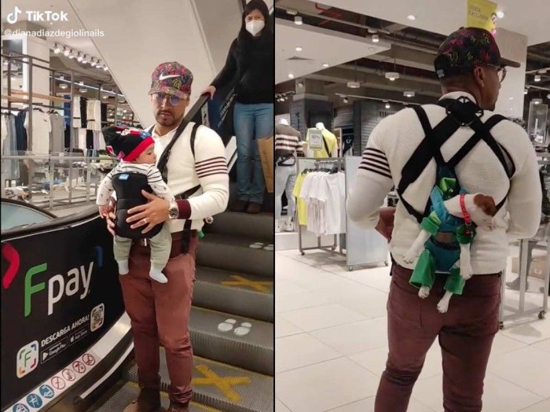 Papá luchón… carga a su hijo y a su perrito con cangurera mientras esperan a mamá