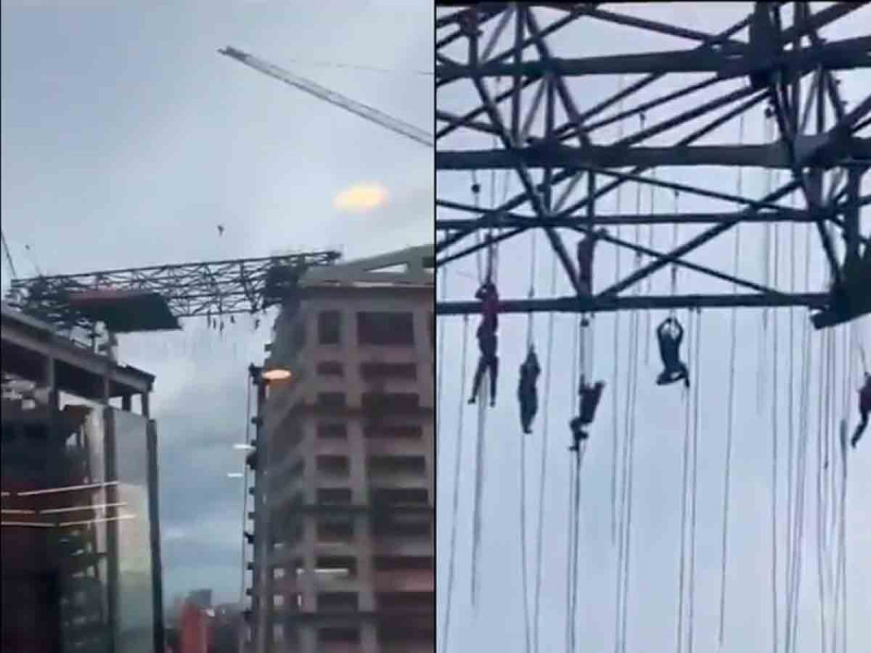 Obreros quedan colgados a más de 100 metros de altura tras desplomarse andamio