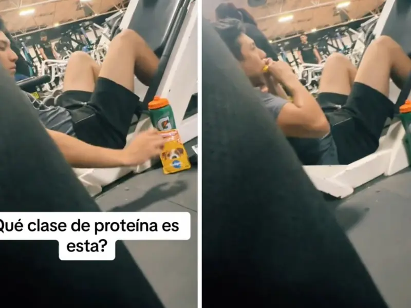 Joven come alimento para perro en gimnasio