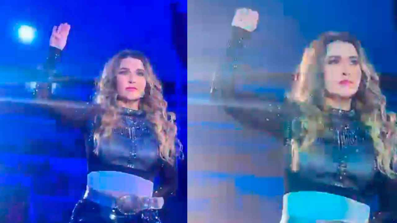 Alicia Villarreal hace señal de auxilio arriba del escenario, tras ser golpeada por su esposo